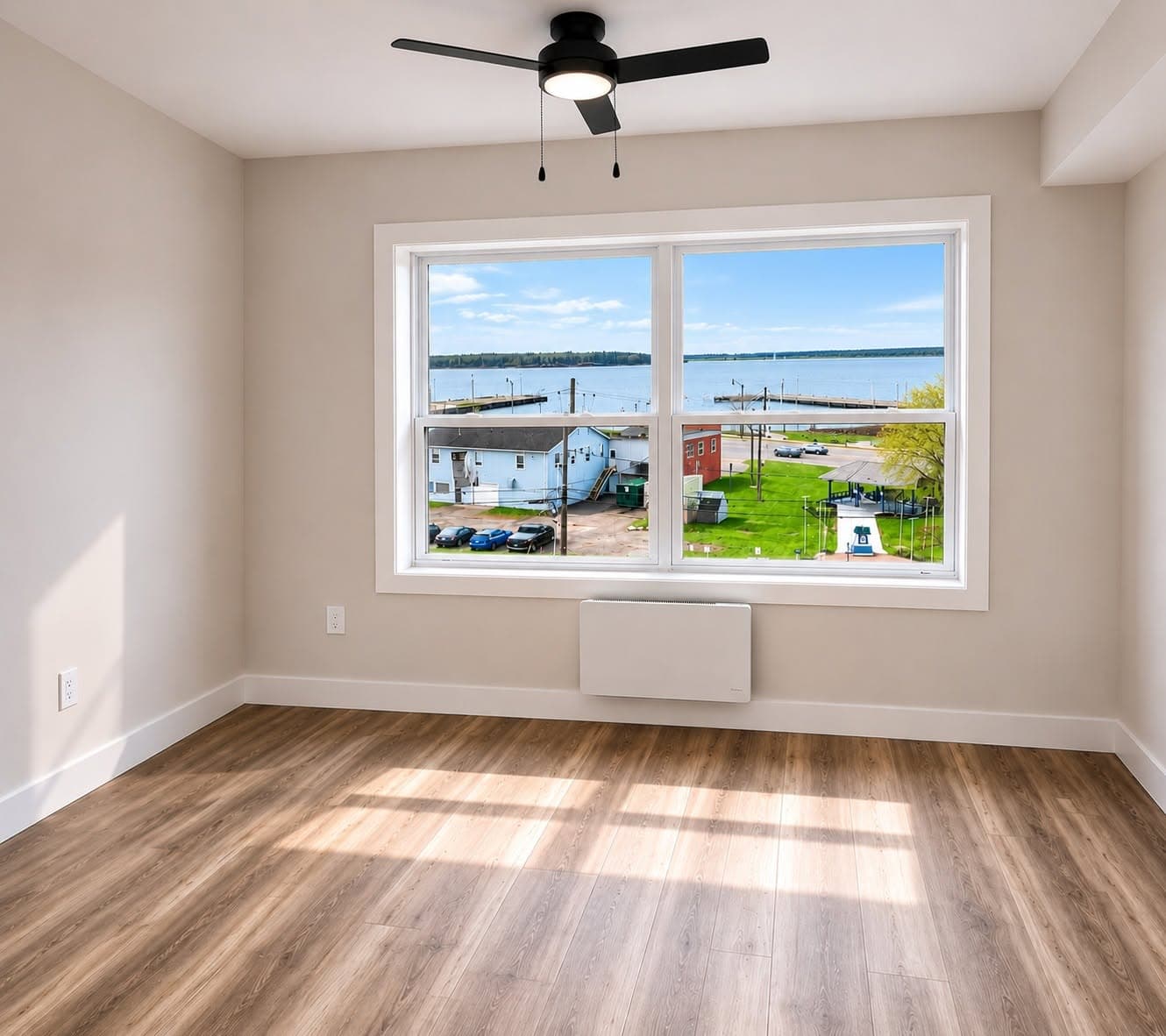 Bright bedroom with large window at 278 Water Street, Summerside