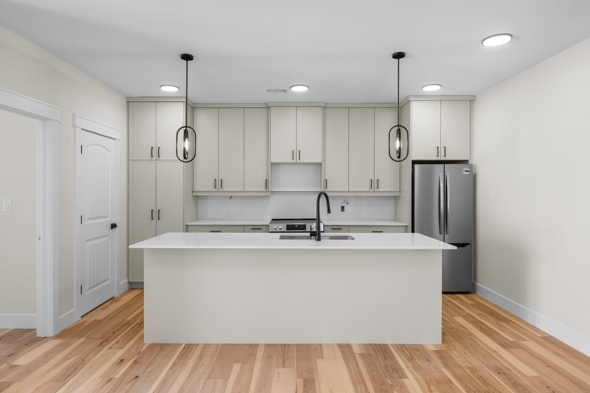 Custom kitchen with quartz countertops and stainless appliances at 522 Capital Drive
