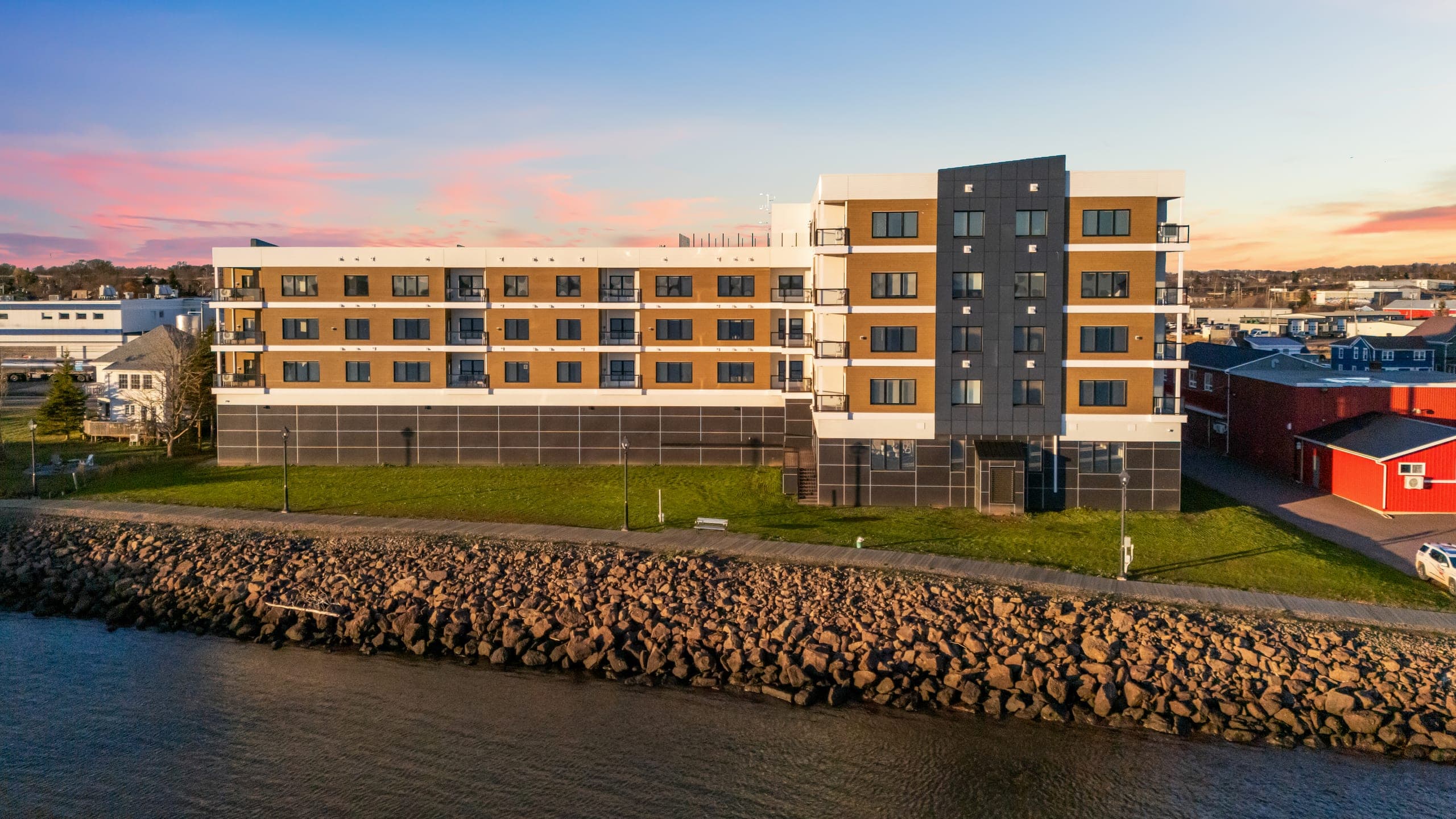 Aerial drone view of The Boardwalk at 68 Water Street on the Summerside waterfront at sunset