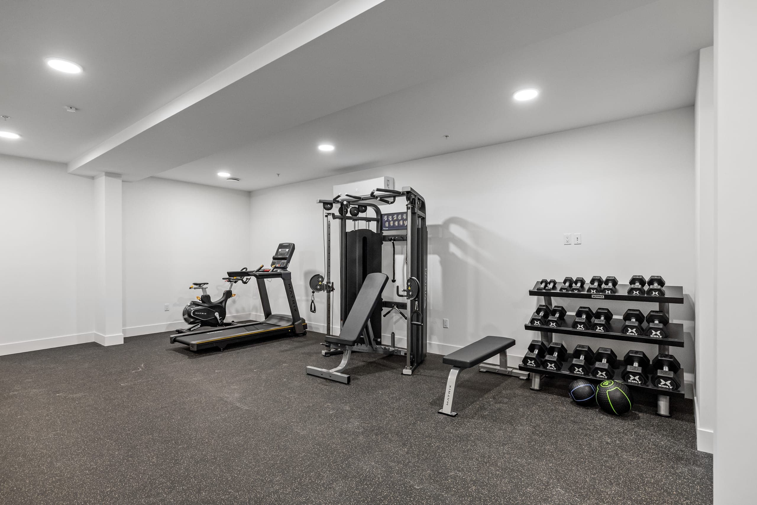On-site 24/7 fitness studio with cardio and strength equipment