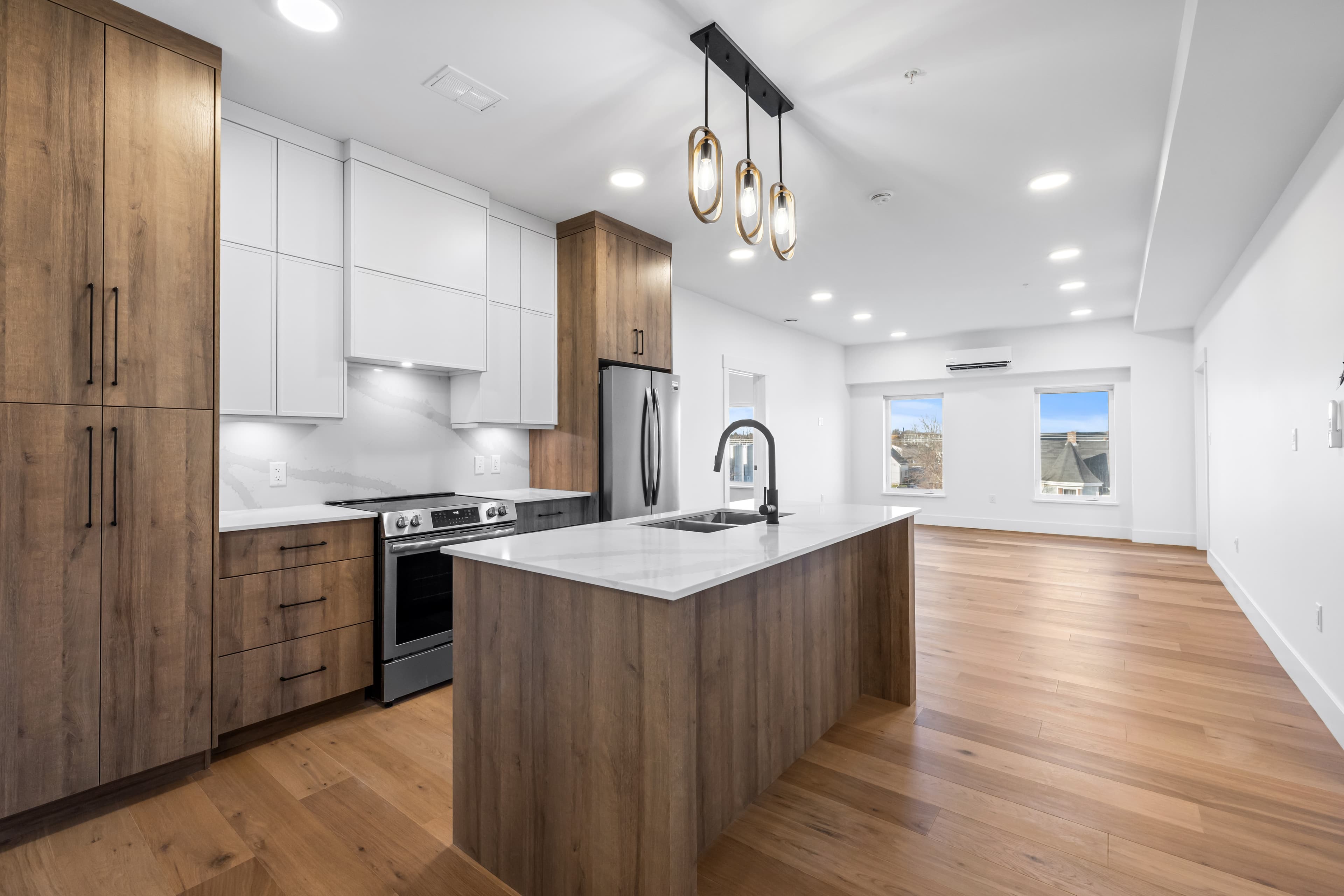 Type 1 designer kitchen with quartz island and harbour-facing living area